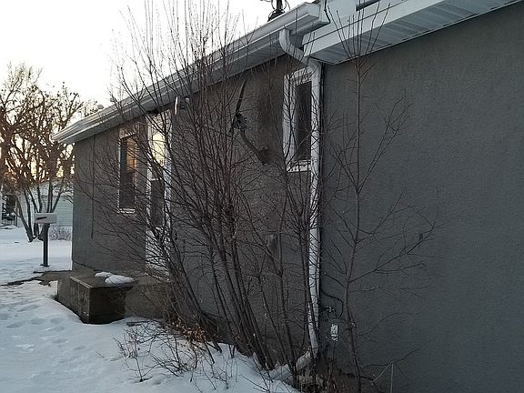 Side of house by driveway 