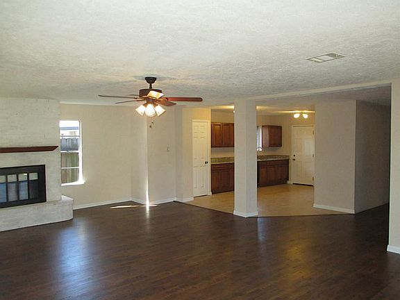 Large updated open living area of the home with fireplace.