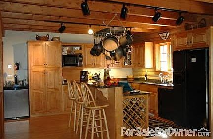 open concept kitchen
						:
						handcrafted maple cabinets and granite counter tops, gas stove