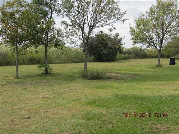 YARD TO LEFT OF HOUSE