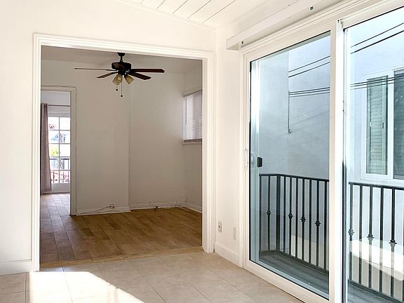 Dining room leading into den.