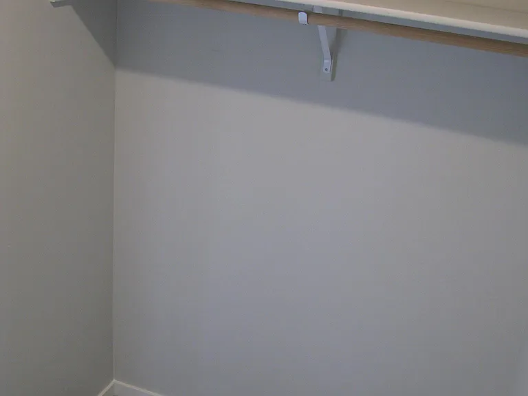 Master closet; clothes rod and shelf on both sides of closet