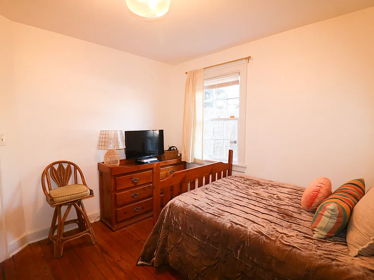 Secondary bedroom has a window to the backyard / patio