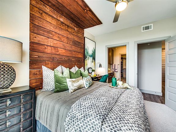 Henley Riverside model bedroom and wood headboard