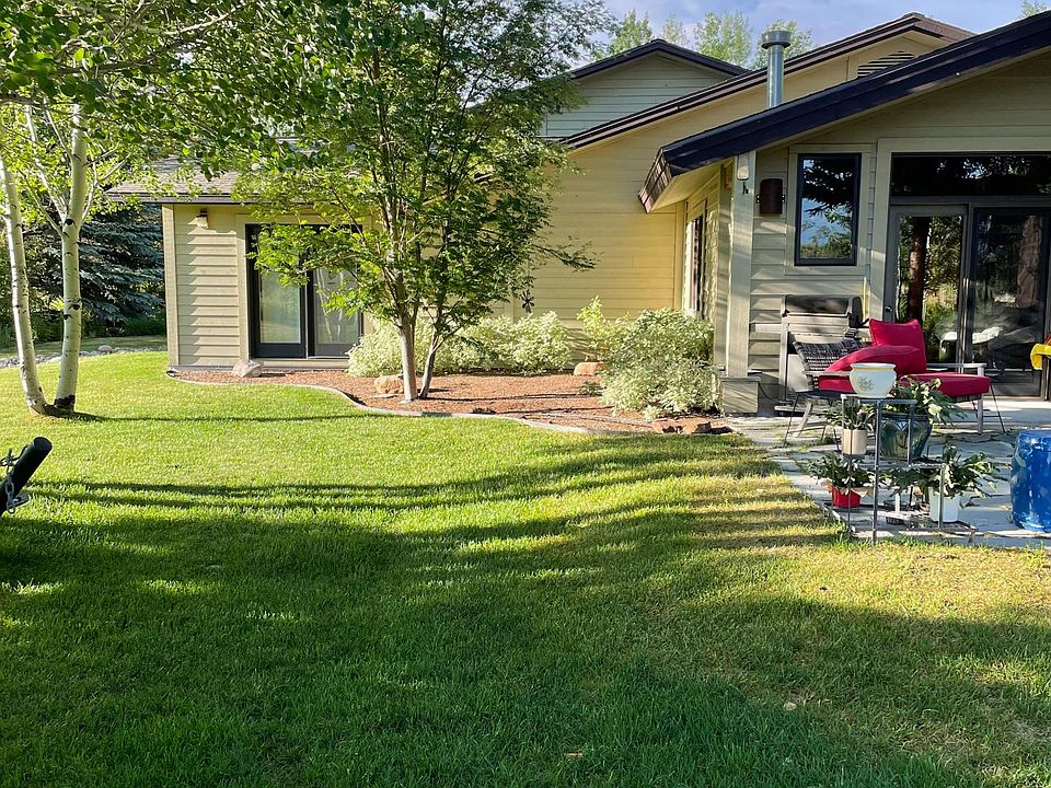 Backyard view to house, patio, gardens