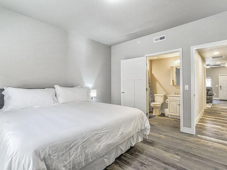 Master bedroom with a king sized bed