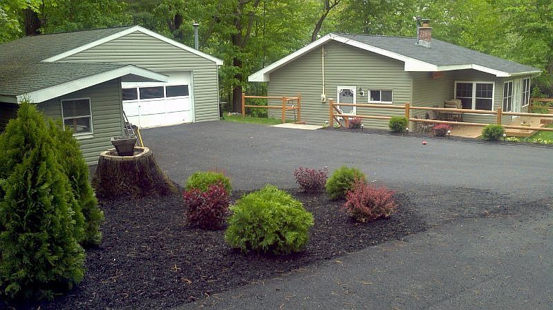 two car garage with seperate large storage shop