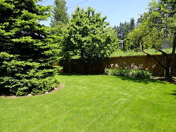 Private, level yard backs to undeveloped space. Securely fenced and nicely landscaped.