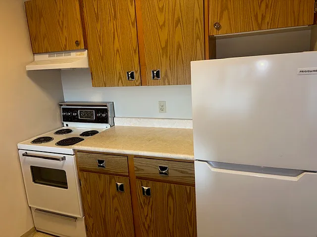 oven and fridge in kitchen