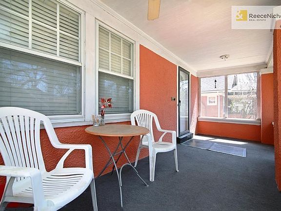 Large front screened porch lets you enjoy your lovely front yard...without the bugs!