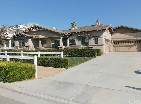 Long driveway that leads to 4 car garage that provides direct access to home