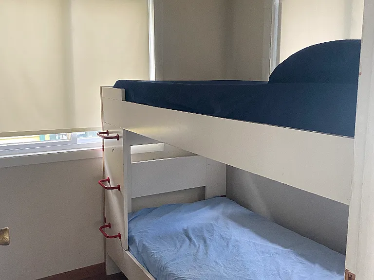 Bedroom# 2. Twin bunks, armoire, and 5 drawer dresser, room :small 7'x7'