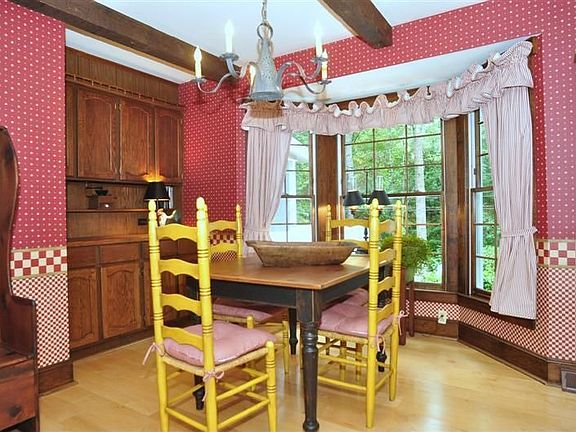 Kitchen's breakfast area nestled in charming bay window