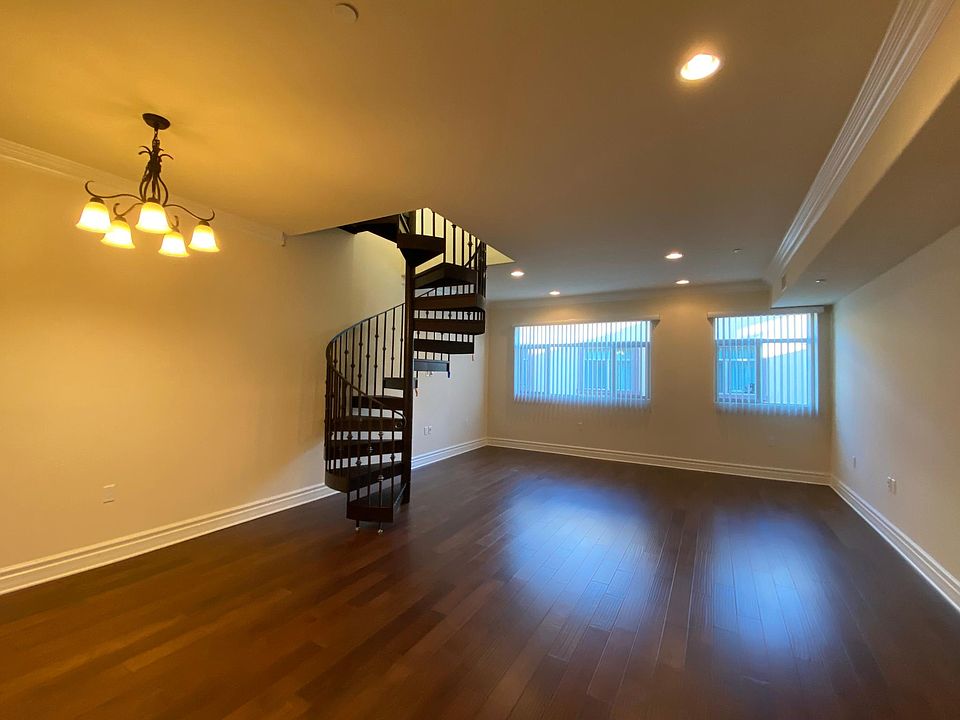 Living room with staircase to the rooftop deck