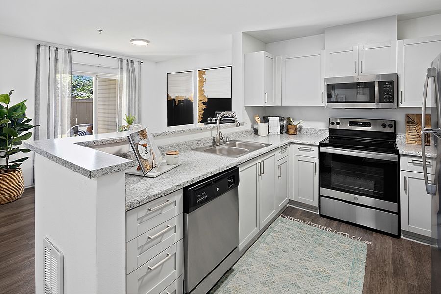 Upgraded kitchens feature new counter tops, stainless steel appliances and shaker-style cabinets