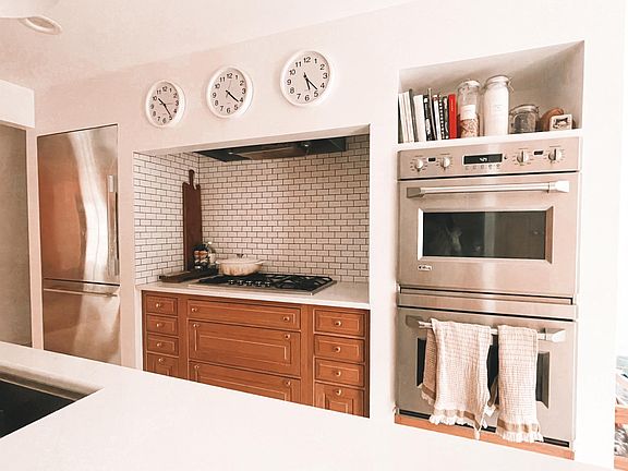 Shelf space above 2 oven range with plenty of storage space for pots and pans.