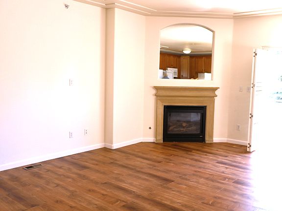 Bright and welcoming living area with brand-new wood flooring and plenty of natural light.