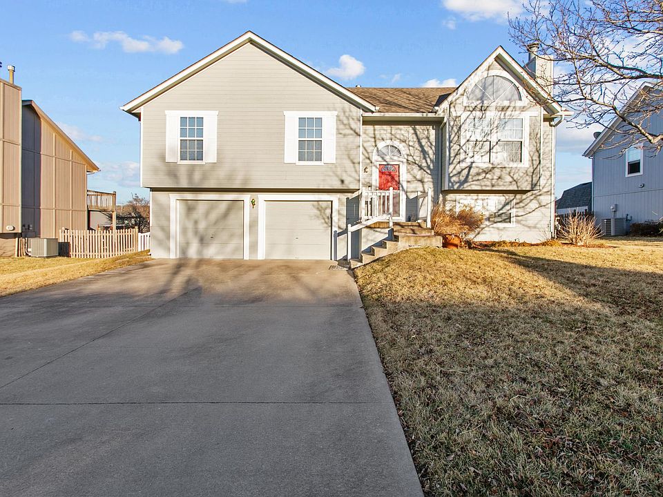 Front view of house from street facing east.