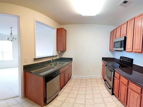 Kitchen - Stainless Steel Dishwasher, Microwave, Oven and Refrigerator