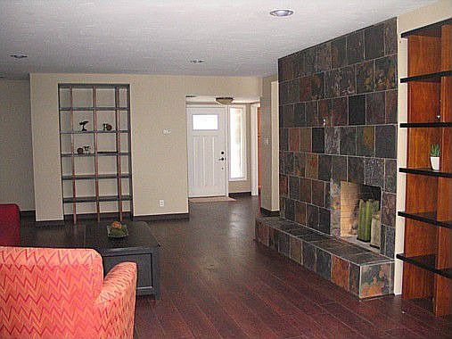 Custom Slate Two-sided Fireplace With Built-ins