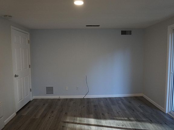 Livingroom with pantry/storage behind closed door - This view is from the kitchen