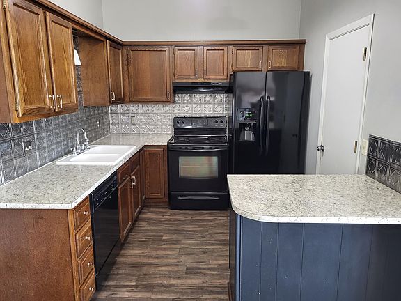 Kitchen, all appliances shown are included. Door to the garage.