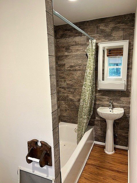 Full bath with washer and dryer.