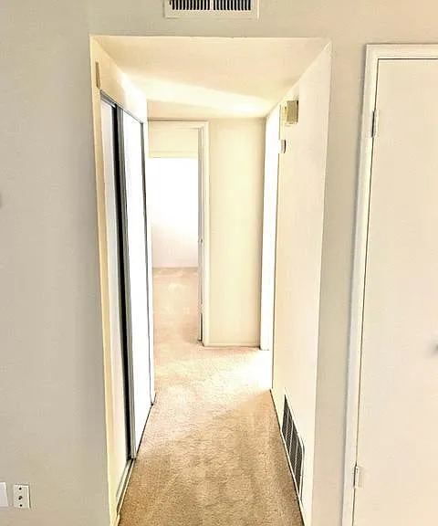 Hallway with even more storage - unit has lots of closet space