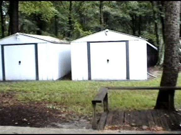 Two 8-10' aluminum storage sheds in back left corner of lot...