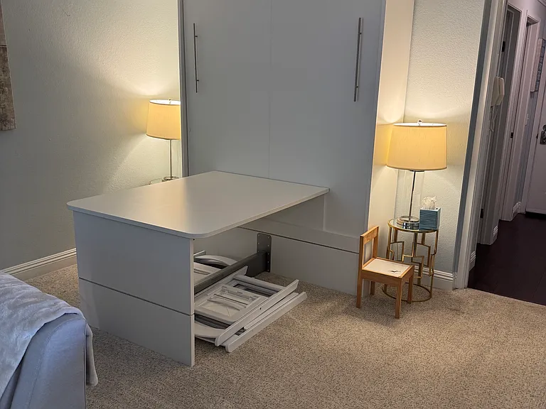 Murphy bed ip. up and dining room table is down.