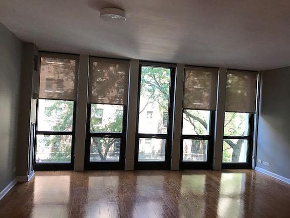 Floor to ceiling windows with shades