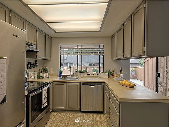 Newer stainless steel appliances, sink, faucet and garbage disposal and linoleum flooring .  Newly painted kitchen cabinets, new blind.