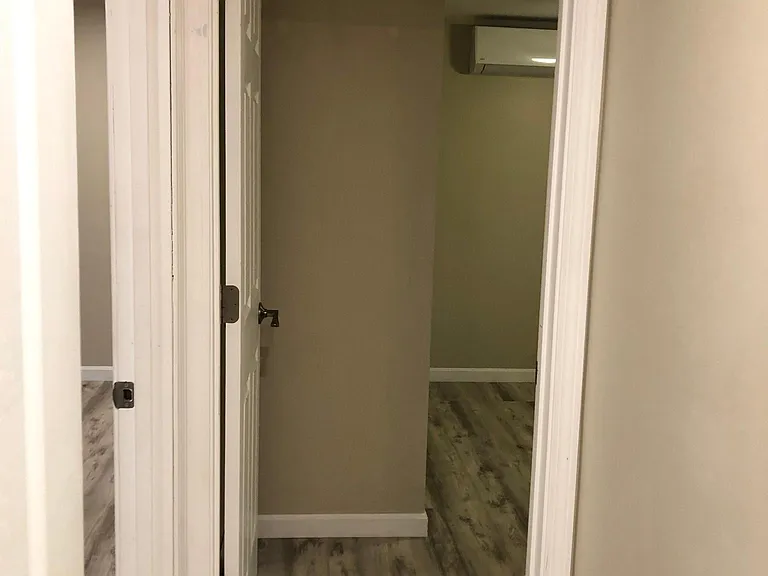 Door to smaller bedroom/office