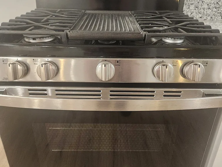 Brand new gas oven/range with built-in griddle.