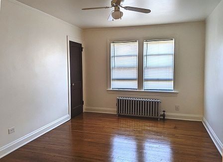 Unlit living room and oak hardwood floor