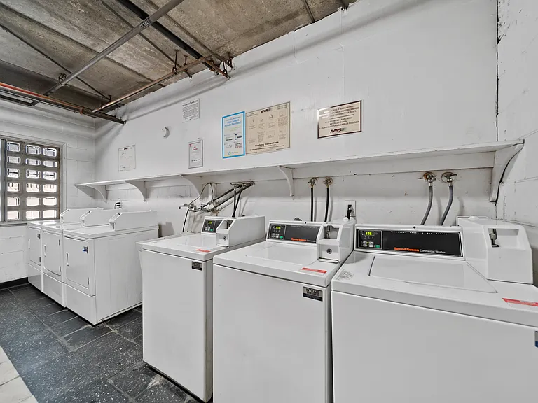 Convenient on-site laundry facilities featuring multiple machines for resident use.