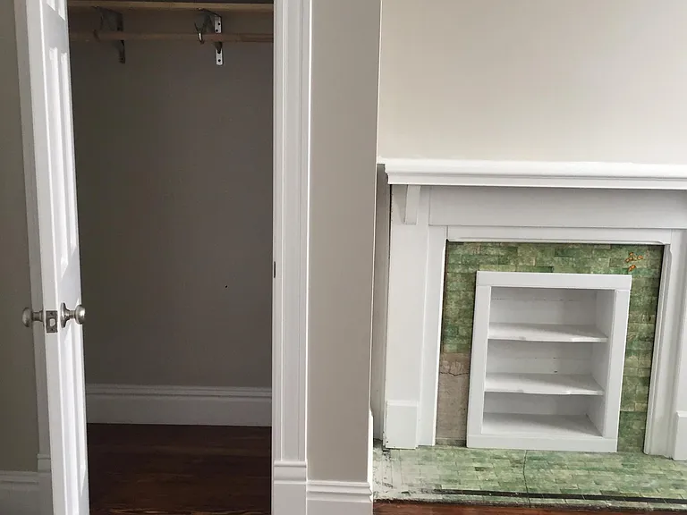 Bedroom 1 closet and fireplace book mantle