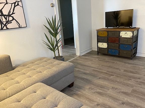 Living room, sectional couch. Get cozy with blanket and game-night storage