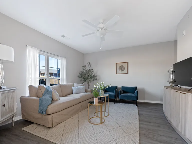 Relax and unwind in this beautifully adorned, light-filled living room. Relax and unwind in this beautifully adorned, light-filled living room.