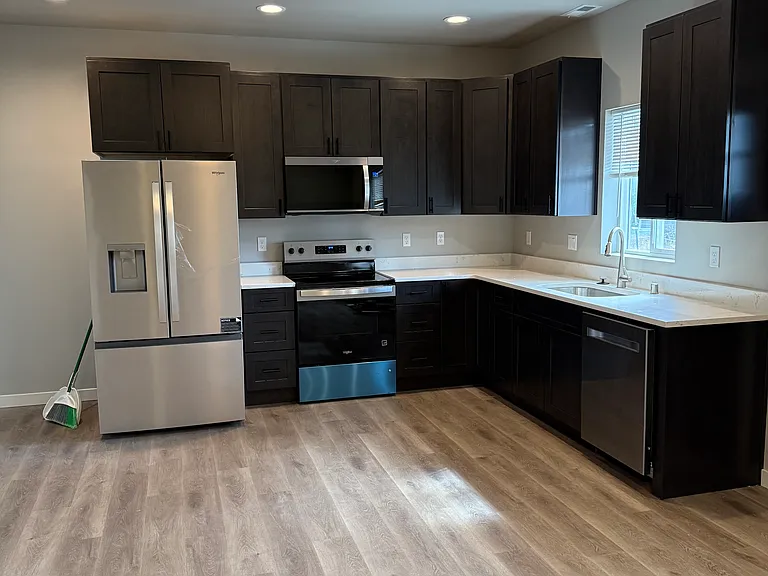 Spacious kitchen with new stainless steel appliances
