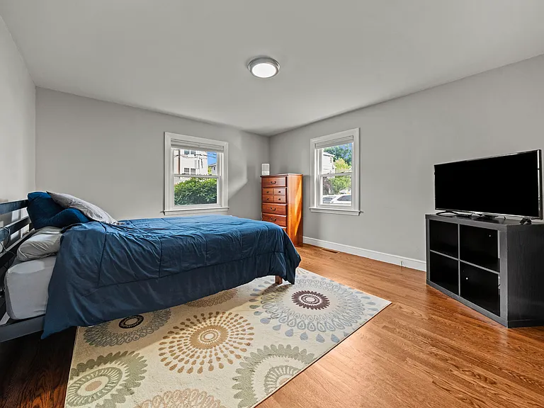 Largest Bedroom, closet with 2 hanging rods (L-shaped) and extra storage space