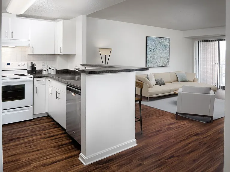 Classic Package I kitchen and living area with white cabinetry, white tile backsplash, dark grey laminate countertops, white appliances, and hard surface flooring