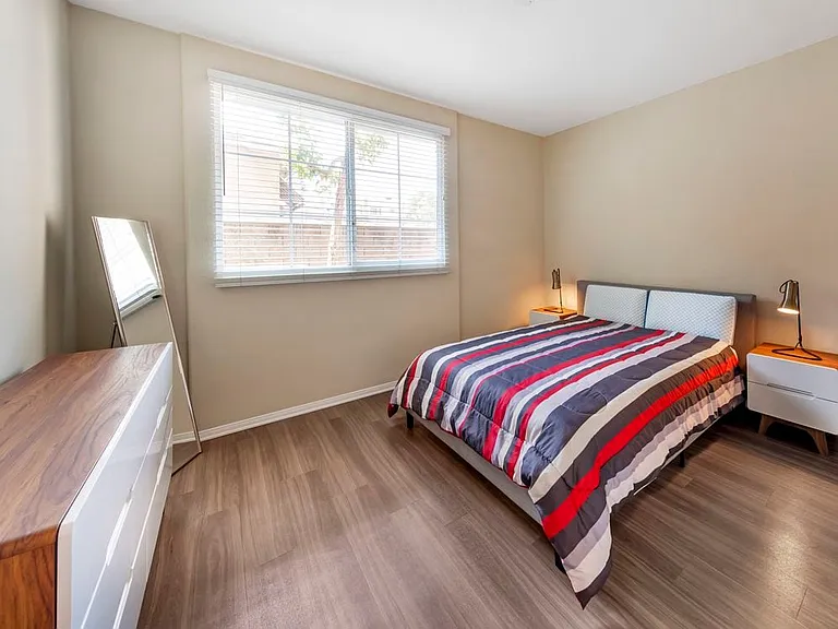 Furnished+ apartment homes feature queen bed with mattress, two pillows, dresser, nightstands, lamp, and mirror. (Representative Image exact items and style of furnishings may vary)