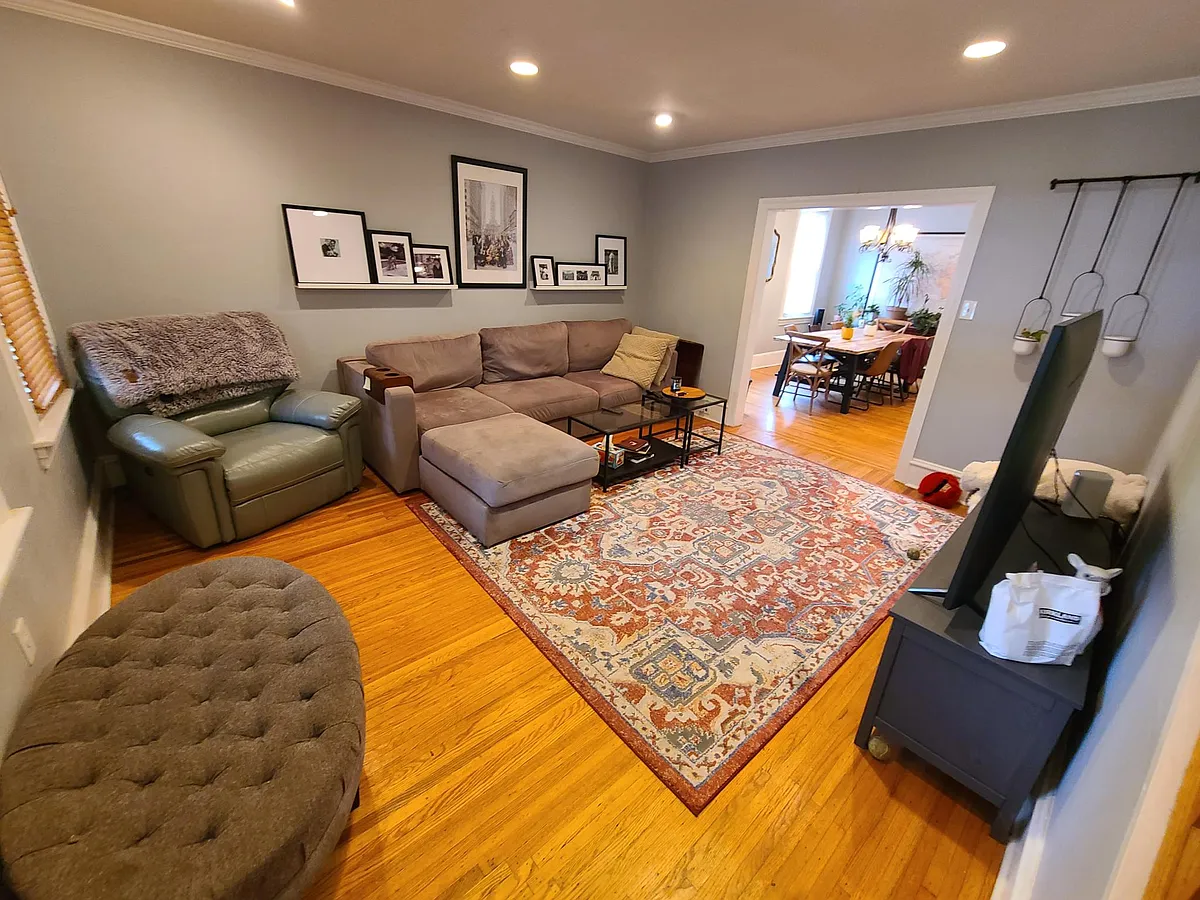 Enter into the nice sized family room! - 220 E 6th Ave