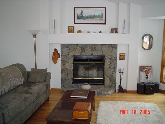 Living room - moss rock fireplace, statuary niches