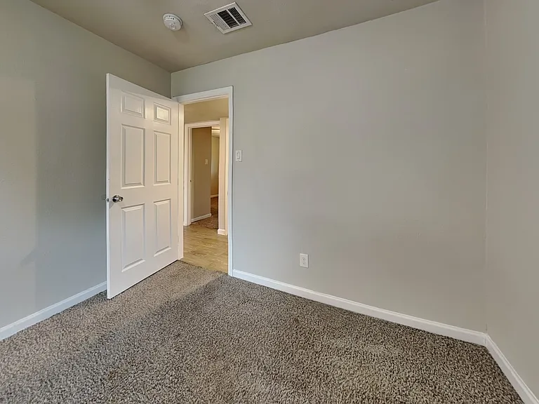 Spacious hallway with neutral