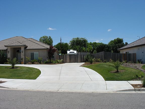Concrete RV Parking on Side of Home