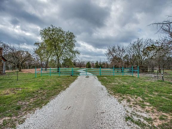 Gated entrance off FM 902, located just east of Lake Kiowa in the Heart of North Texas Horse Country.