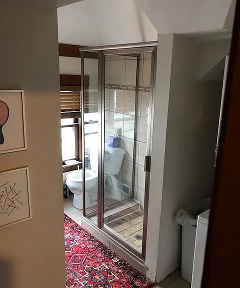 bathroom custom walk in shower with porcelain tile