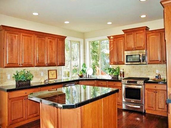 Gorgeous kitchen with high-end cabinets, granite, stainless steel appliances and two large pantries (one walk-in pantry)